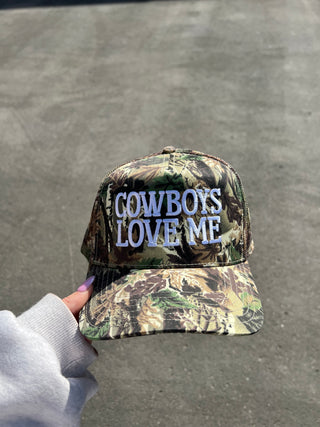 Camo “Cowboys Love Me” Trucker Hat