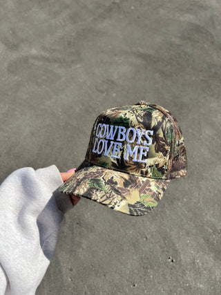 Camo “Cowboys Love Me” Trucker Hat