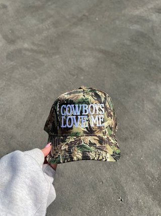 Camo “Cowboys Love Me” Trucker Hat
