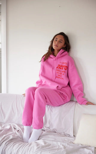 The Mayfair Group “It Costs $0.00 To Be A Nice Person” Pink Hoodie