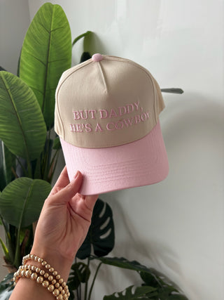 “But Daddy He’s A Cowboy” Blush Trucker Hat