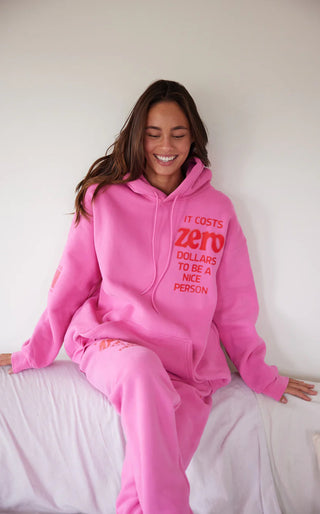 The Mayfair Group “It Costs $0.00 To Be A Nice Person” Pink Hoodie